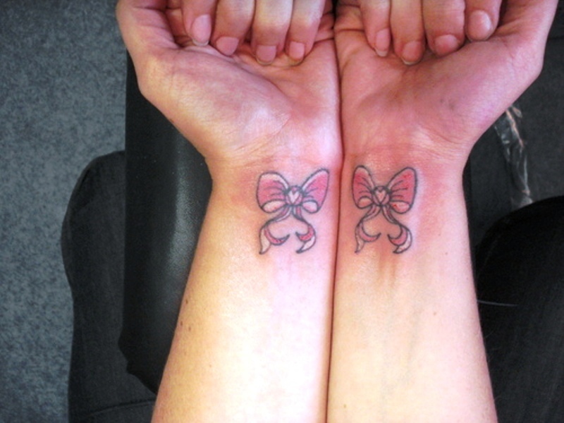 2 Pink Bows Tattoos On Both Wrist