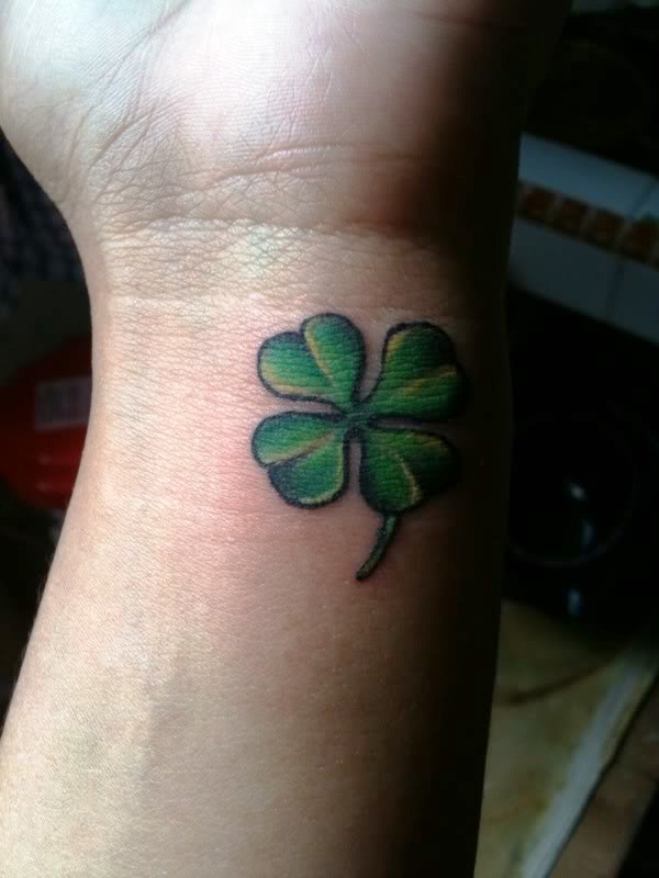 Adorable Four Leaf Tattoo On Wrist