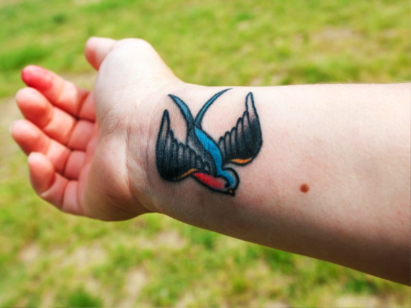 Amazing Blue Bird Tattoo On Wrist
