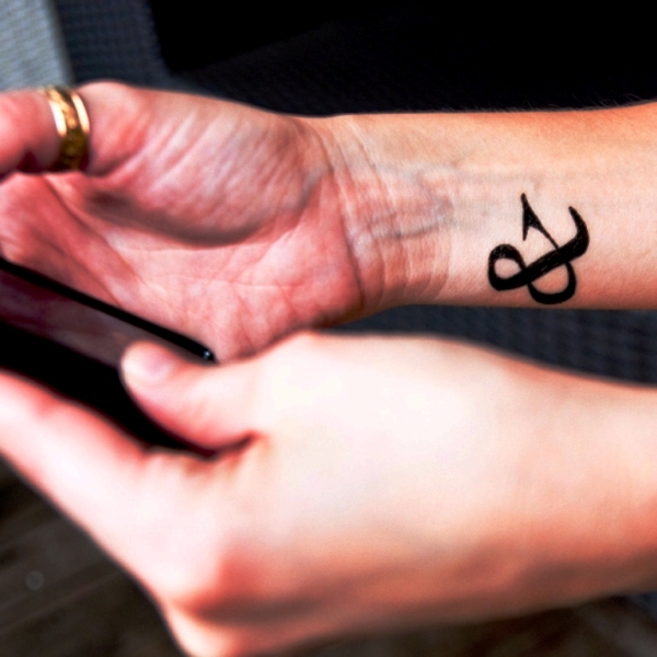 Attractive Ampersand Wrist Tattoo
