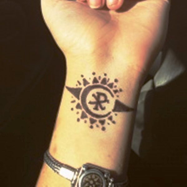 Attractive Sun Tattoo On Wrist