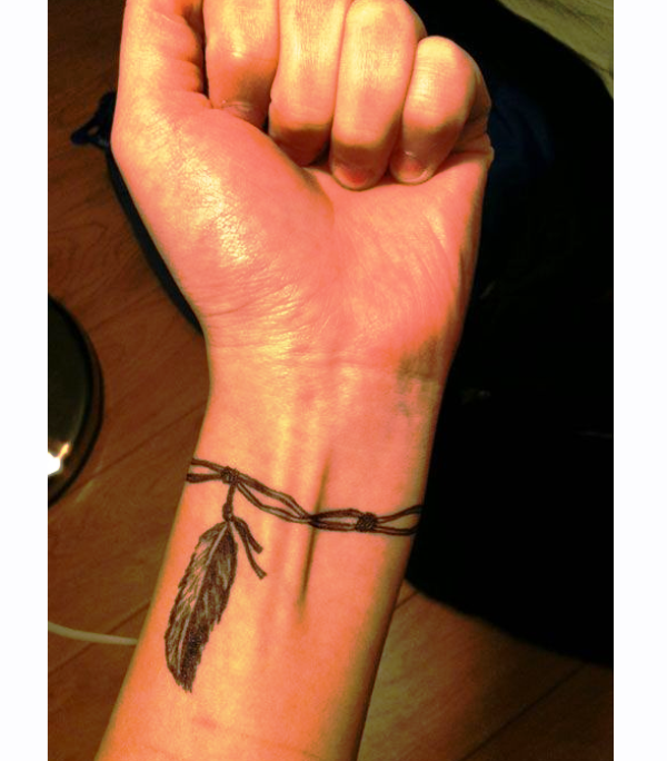 Awesome Feather Tattoo With Barbed Wire