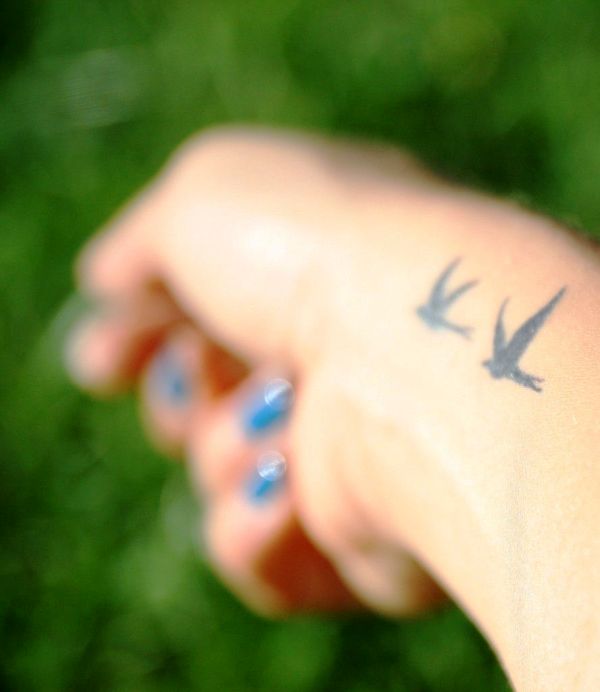 Awesome Flying Birds Tattoo On Wrist