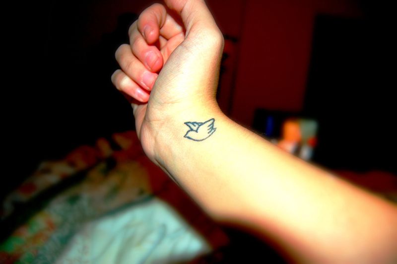 Beautiful Blue Bird Tattoo On Wrist