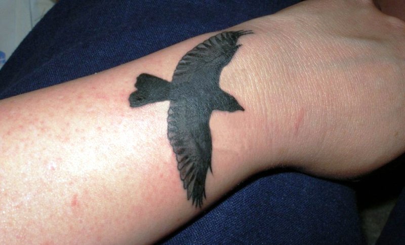 Big Black Bird Tattoo On Wrist