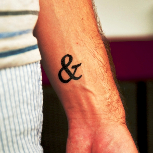 Black Ampersand Wrist Tattoo
