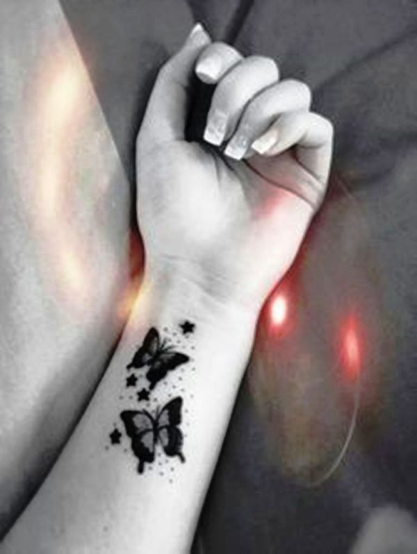 Black And White Butterfly Tattoo On Wrist