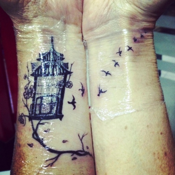 Black Bird And Cage Wrist Tattoo