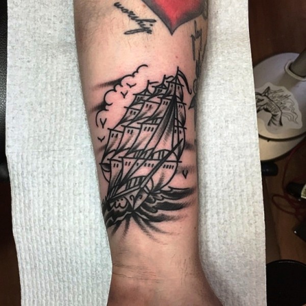 Black Boat Tattoo On Wrist