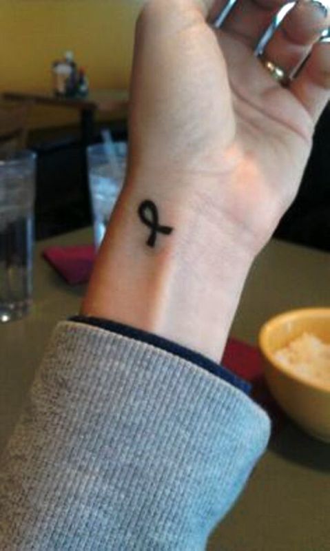 Black Cancer Ribbon Tattoo On Wrist