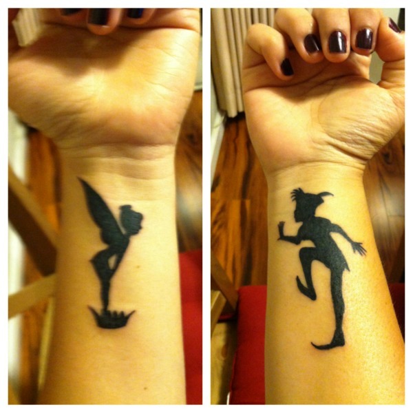 Black Colored Peter Pan Wrist Tattoo