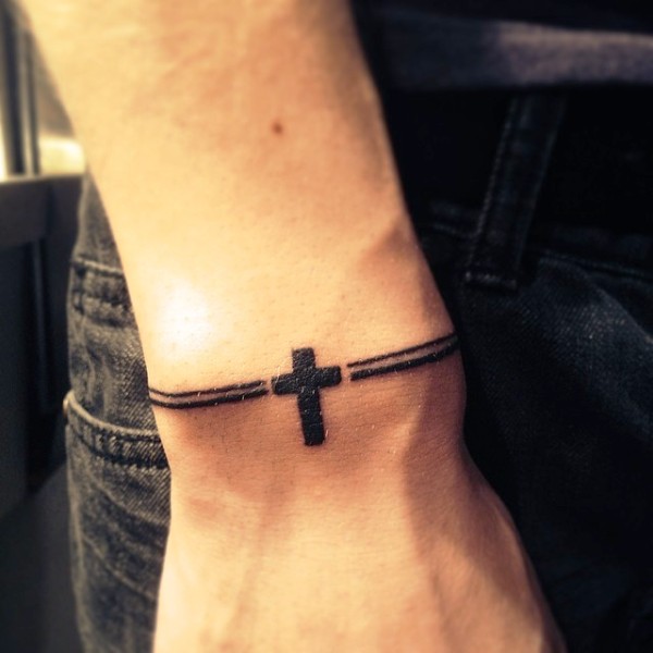 Black Cross Tattoo On Side Wrist