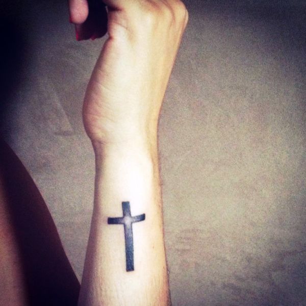 Black Cross Tattoo On Side Wrist