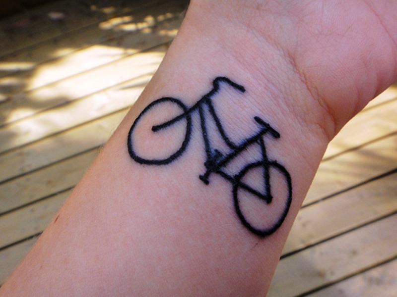 Black Cycle Tattoo On Wrist