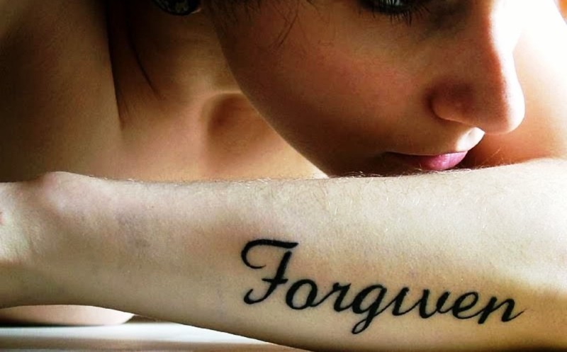 Black Forgiven Wrist Tattoo