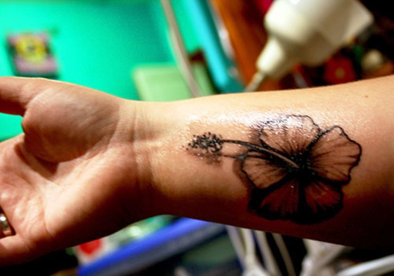 Black Hibiscus Wrist Tattoo