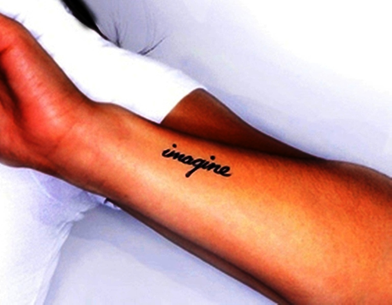 Black Imagine Wrist Tattoo