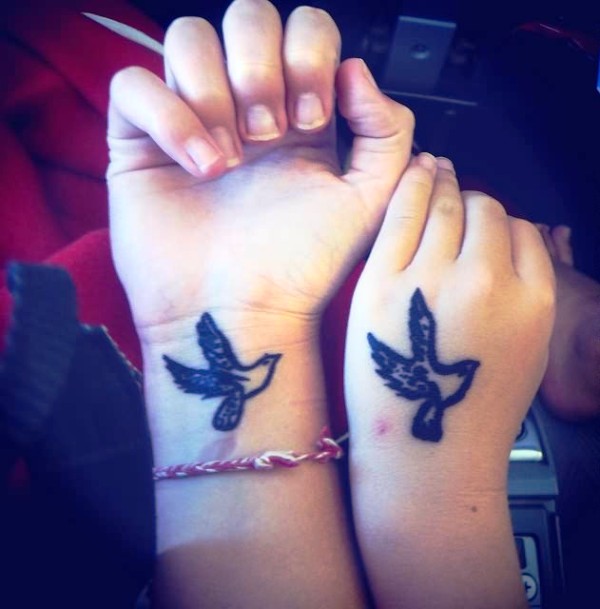 Black Inked Birds Tattoo On Wrist