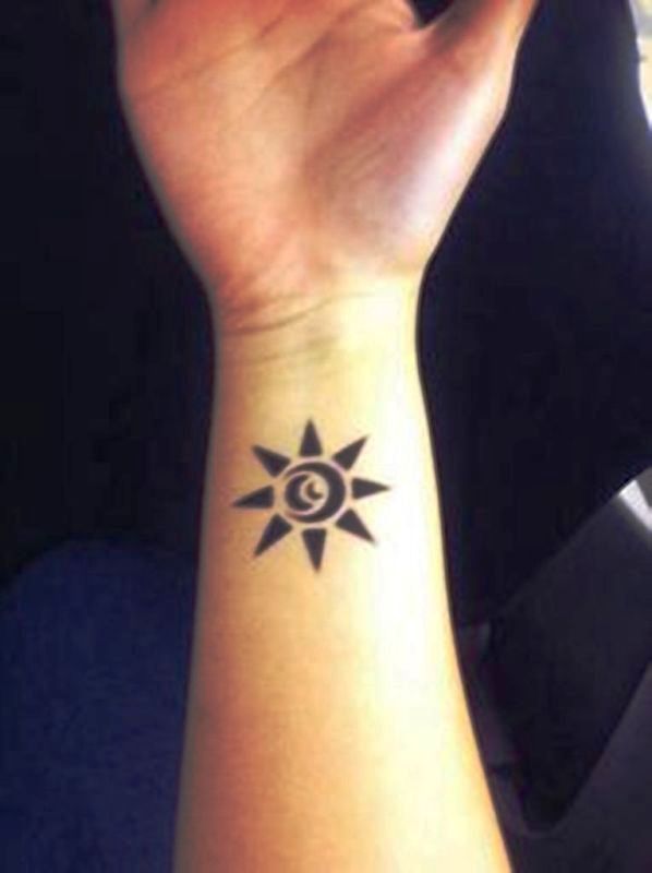 Black Sun Tattoo On Wrist