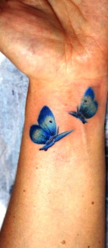Blue Butterflies Tattoo On Wrist