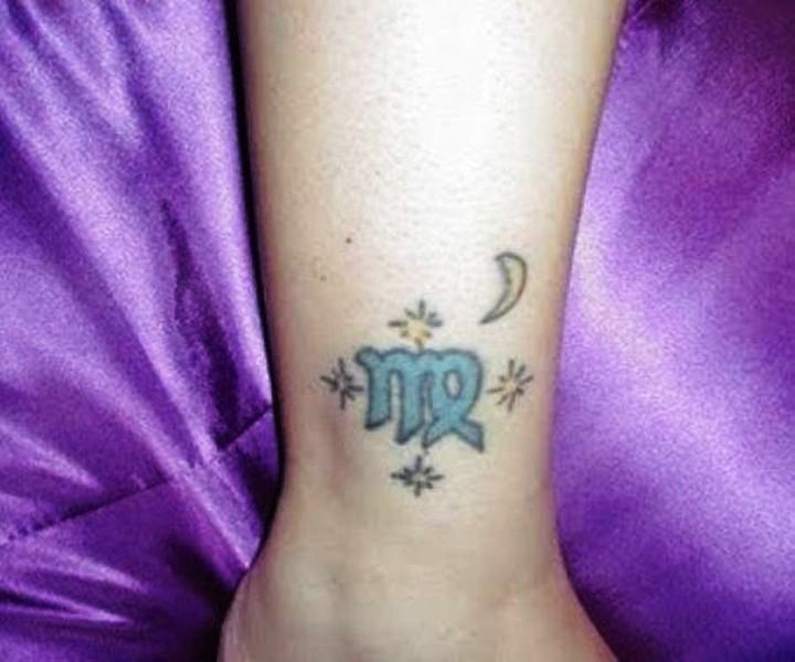 Blue Color Virgo Tattoo On Wrist
