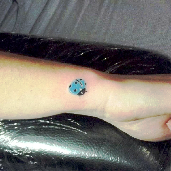 Blue Ladybug Tattoo On Wrist