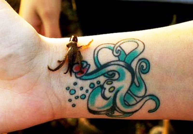 Blue Octopus Tattoo On Wrist