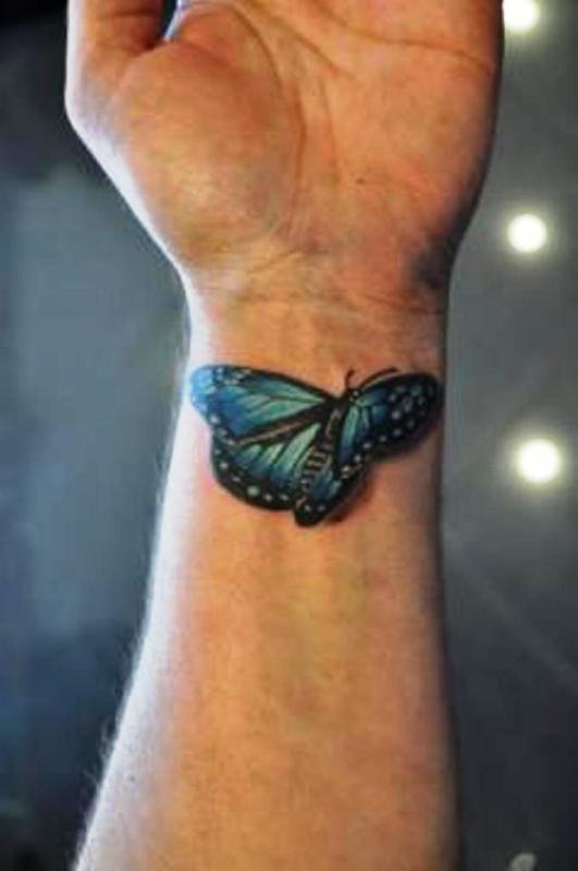 Blue Realistic Butterfly Tattoo On Wrist