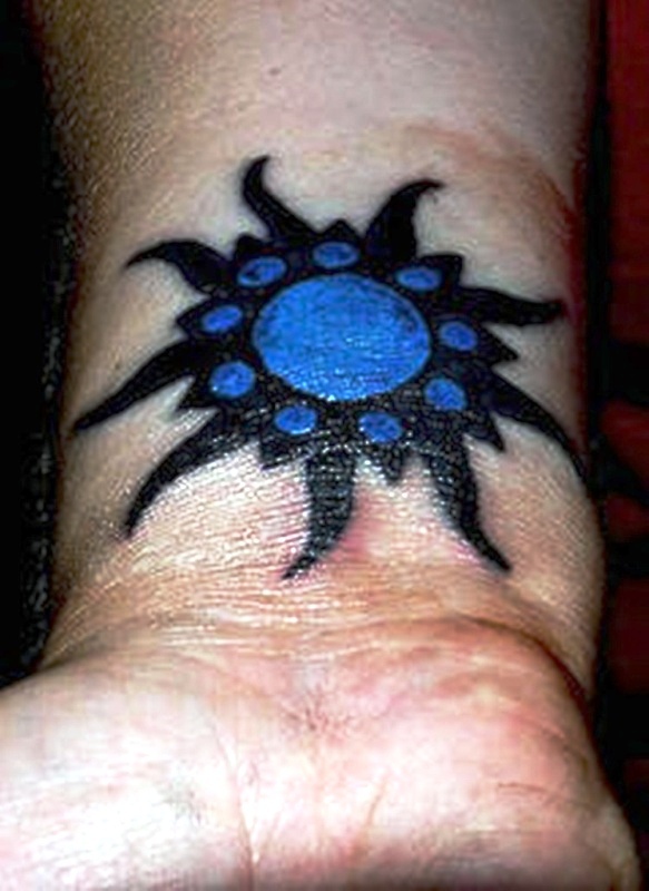 Blue Sun Tattoo On Wrist
