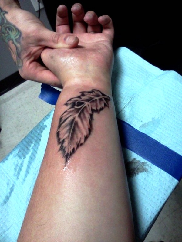 Classy Peacock Feather Wrist Tattoo