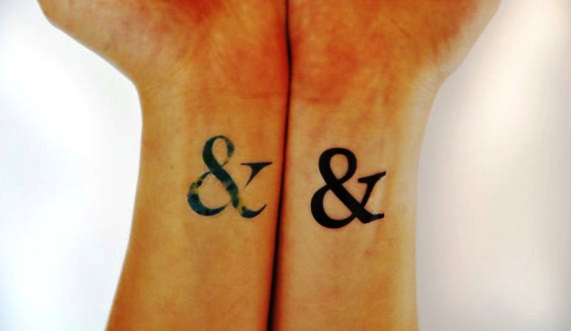 Colored And Black Ampersand Wrist Tattoo