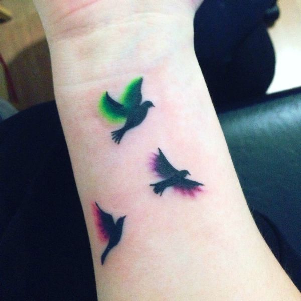 Colorful Flying Birds Tattoo Design