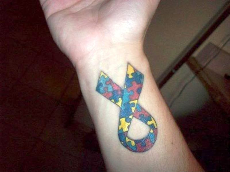 Colorful Ribbon Autism Tattoo On Wrist