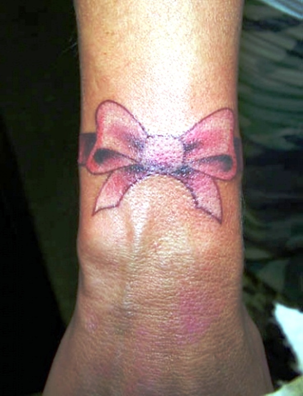 Cool Pink Bow Tattoo On Wrist