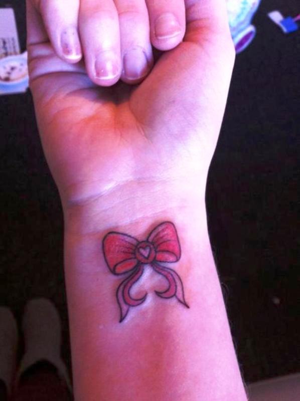 Cool Red Bow Tattoo On Wrist