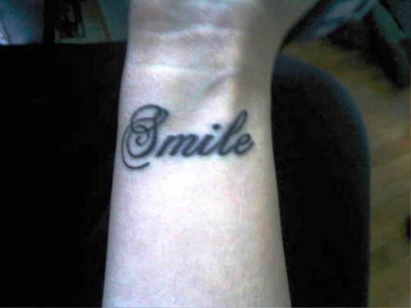 Cool Smile Tattoo On Wrist
