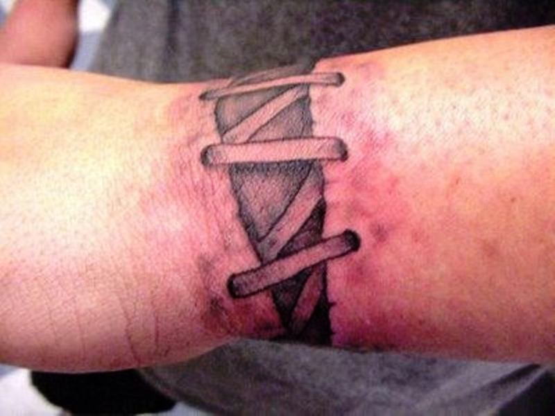 Corset Tattoo On Wrist