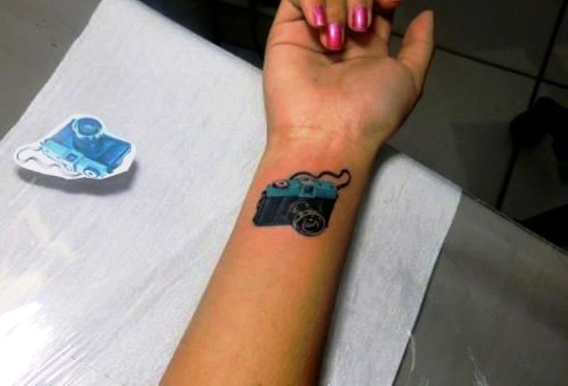 Cute Blue Camera Tattoo On Wrist