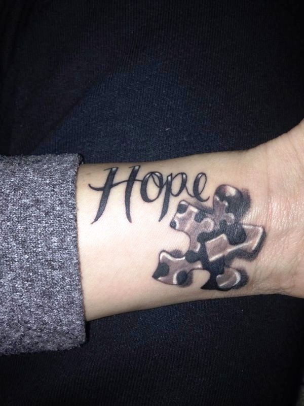 Dark Black Autism Tattoo On Wrist
