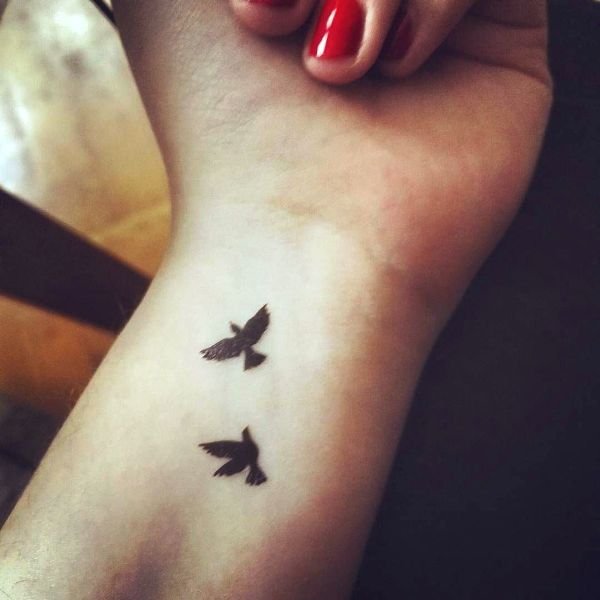 Dazzling Black Flying Birds Tattoo Design
