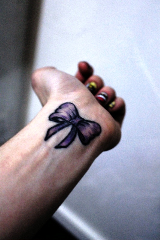 Dazzling Bow Tattoo On Wrist