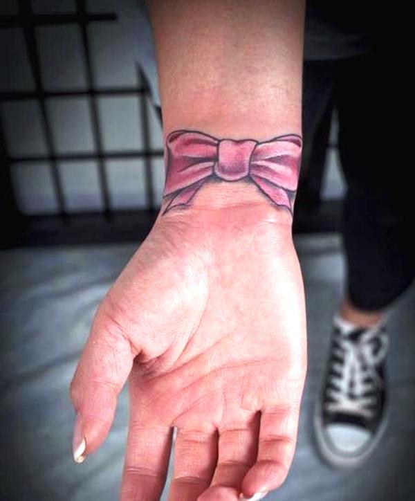 Dazzling Pink Bow Tattoo On Wrist