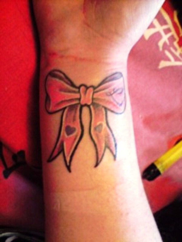 Delightful Bow Tattoo On Wrist