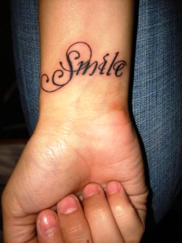 Designer Smile Wrist Tattoo