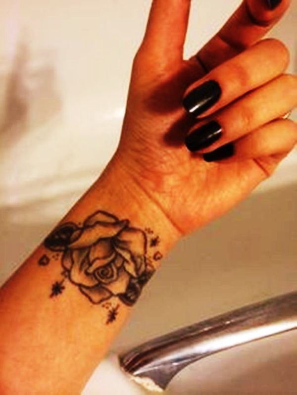 Elegant Black Rose Tattoo On Wrist