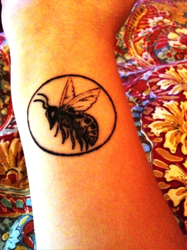 Excellent Black Bee Tattoo On Wrist