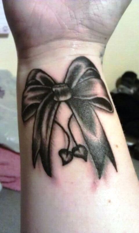 Excellent Black Bow Tattoo On Wrist