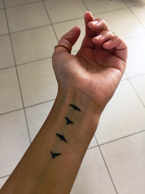 Excellent Flying Birds Tattoo On Wrist
