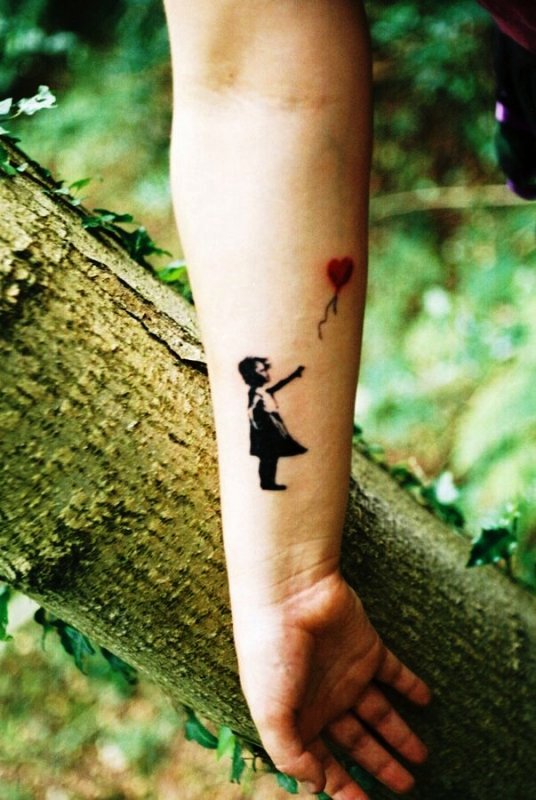 Girl Catching Balloon Tattoo On Wrist