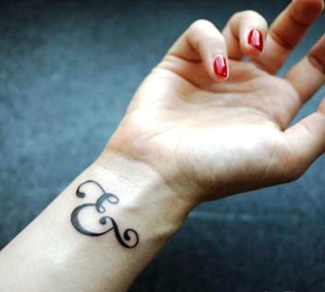 Graceful Ampersand Wrist Tattoo
